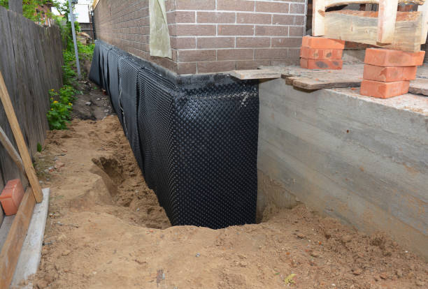 SJ Waterproofing Pros technician performing targeted Interior Drainage System assessment in Glyndon, MD